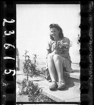 Young woman holding a bouquet of flowers