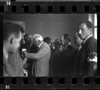 Mordechai Chaim Rumkowksi, Elder of the Jews, recieving a gift, among Jewish police officers and administrators