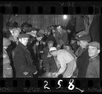 Administrator overseeing distribution of food