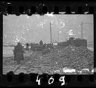 Jewish policeman overseeing the delivery of food to the ghetto