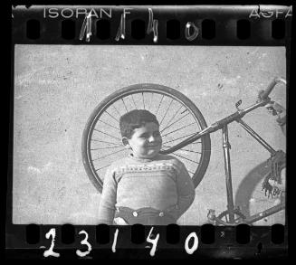 Portrait of a boy with a bike