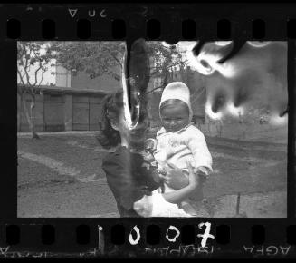 Woman holding a baby in her arms