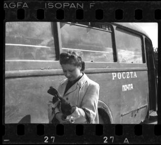 Woman posing with a mail truck