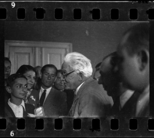 Mordechai Chaim Rumkowksi talking to attentive youth