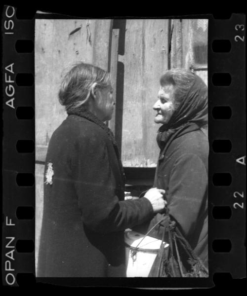 Two women talking in the street