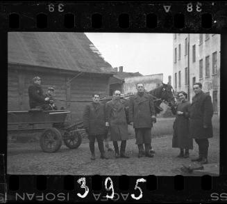 Mr. Elefant, Transport Department administrator and workers standing in front of a horse-drawn cart in the ghetto