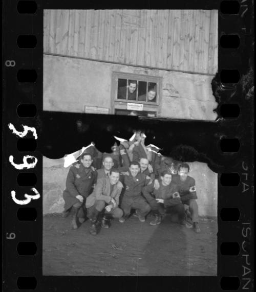 Group of Jewish police posing in the doorway of a food distribution station in Marysin