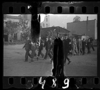 Jewish police marching in the ghetto
