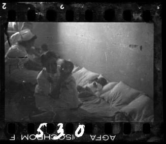 Nurses and babies, in the hospital nursery