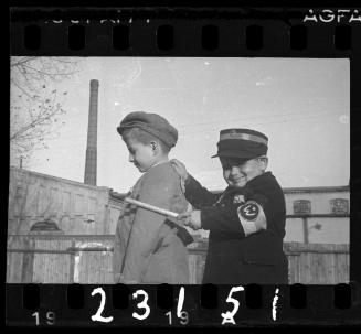 Children playing in the ghetto; “Jewish Policeman” capturing an “offender”