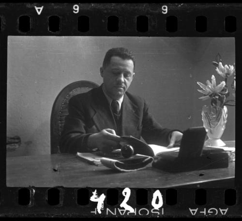 Administrator reading at his desk