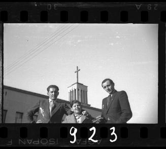 Portrait of two men with a boy