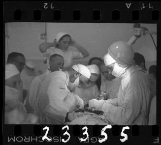 Doctors performing surgery on baby