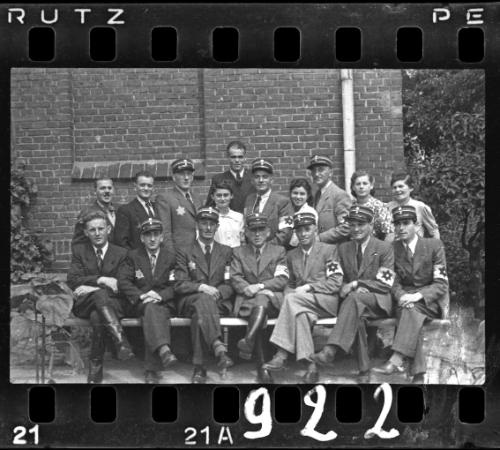 Group portrait of Jewish policeman and four unidentified women in the ghetto