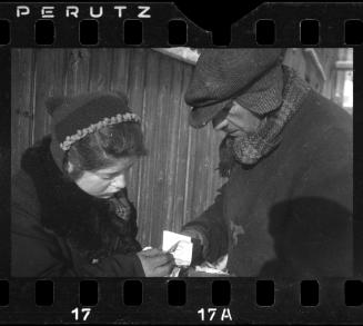 Man and woman conferring on the street