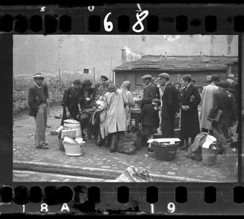 Residents sorting through goods on the street