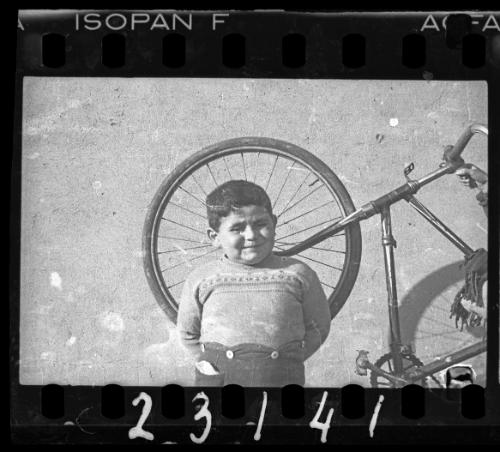 Portrait of a boy with a bike