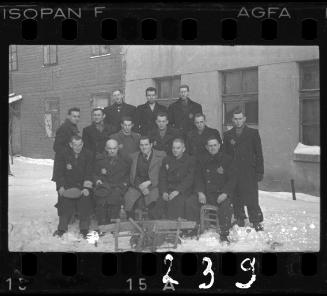 Group portrait of Jewish men in the ghetto in winter