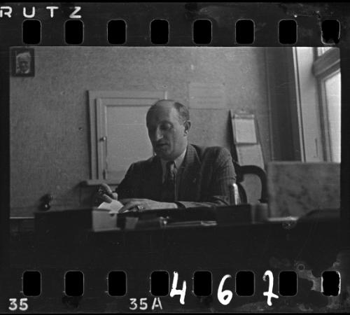 An administrator working at his desk