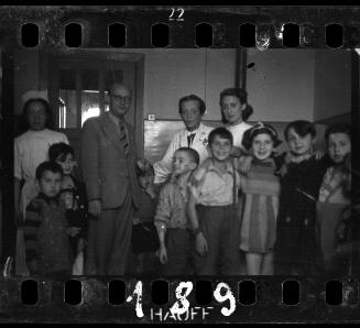 Children with nurses and administrator