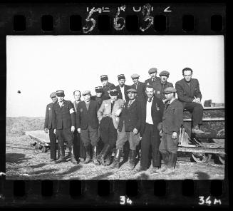 Group portrait of Jewish policemen, administrators, and workers