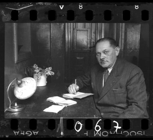 A member of the ghetto administration sitting at his desk
