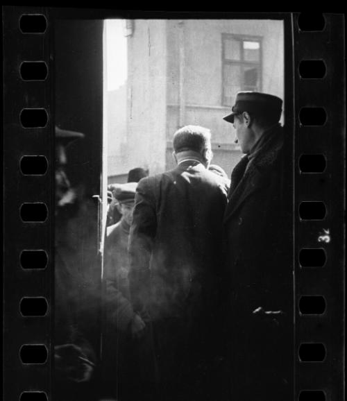 A Jewish policeman and an unidentified man standing in a doorway