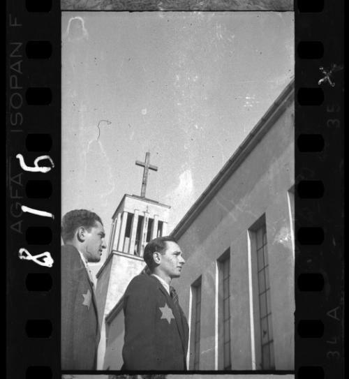 Two young Jewish men near a church on Wawelska Street in the ghetto