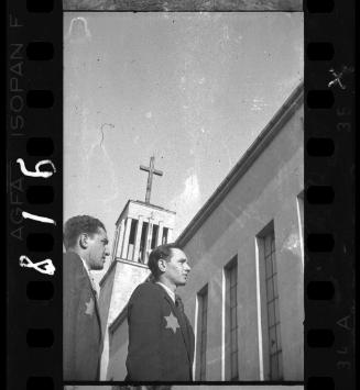 Two young Jewish men near a church on Wawelska Street in the ghetto