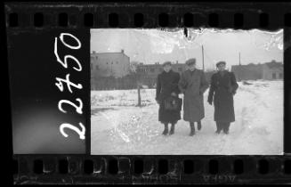 Residents walking down the street in winter