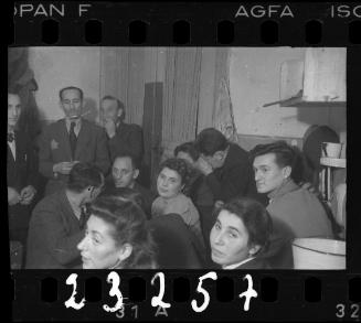 Group of residents gathered in a home in the ghetto