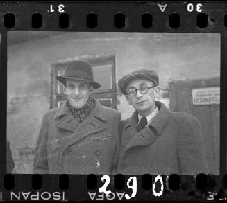 Mr. Elefant, Transport Department administrator and an unidentified man, outside horse stables in the ghetto