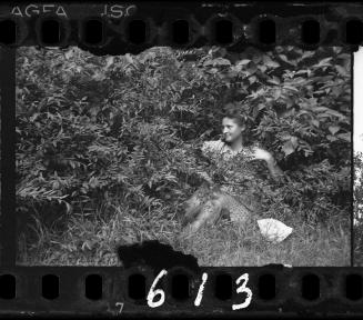Young woman seated on the grass