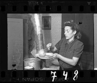 Stefanaia Schoenberg ladling soup into a bowl