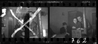 Two men wearing leather coats and a woman