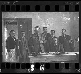 Jewish policemen and members of the Food Supply Department in an office in the ghetto