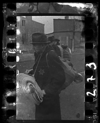 An elderly man being deported from the Lodz ghetto