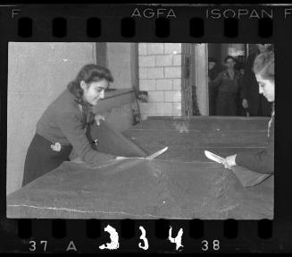 Women cutting fabric at the leather factory