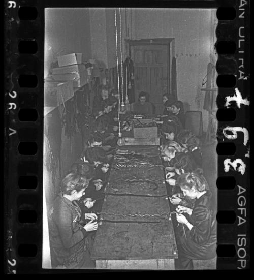 Women plaiting decorative bands in a workshop ("ressort") in the ghetto