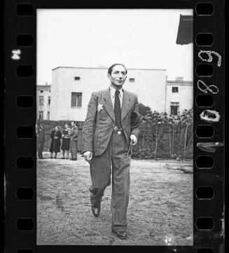 Male ghetto resident walking