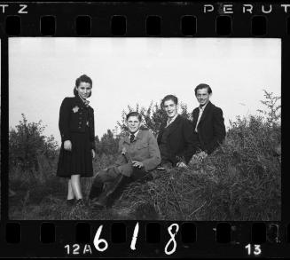 Residents, sitting on a hill