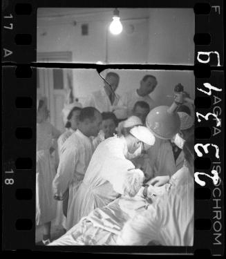 Doctors performing surgery on baby