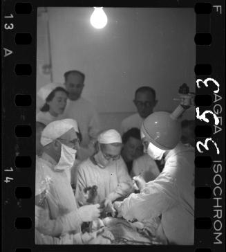 Doctors performing surgery on baby