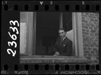 Portrait of a man at a window