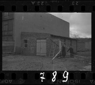 Two men working with wood
