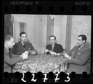 Portrait of four men around the table