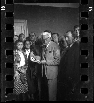 Mordechai Chaim Rumkowski, Elder of the Jewish Council, surrounded by members of the ghetto administration
