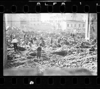 View of residents digging in the ruins of the synagogue on Wolborska Street, destroyed by the Germans in 1939