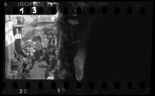 Residents sorting belongings left behind after deportation