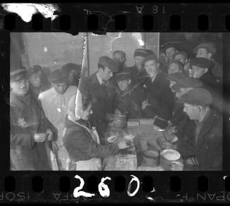 Jewish policemen oversee distrubution of food